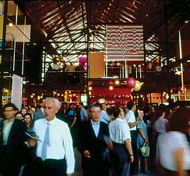 Visitors in the glass pavilion. The Exhibition featured a wide variety of American modern art, from paintings to sculptures.