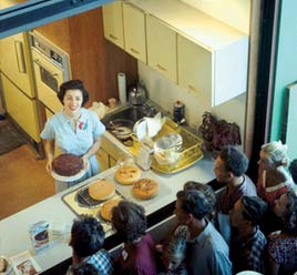 A guide demonstrates an American style kitchen